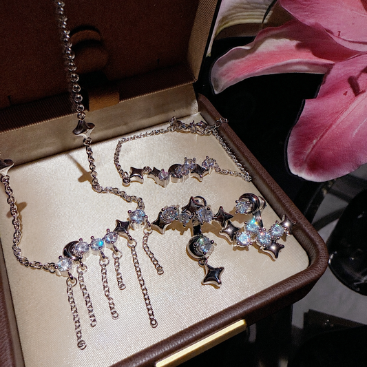 Women’s Celestial Cubic Zirconia Necklace, Earrings, Bracelet & Ring Set with Star and Tassel Details
