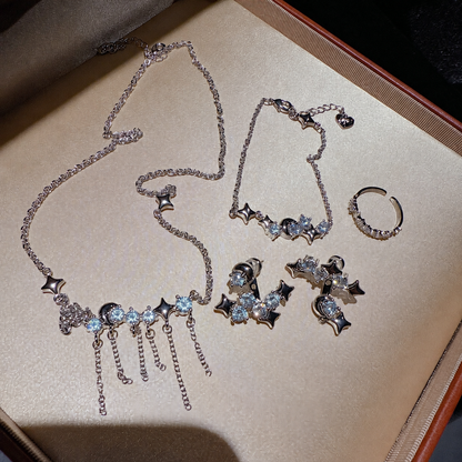 Women’s Celestial Cubic Zirconia Necklace, Earrings, Bracelet & Ring Set with Star and Tassel Details