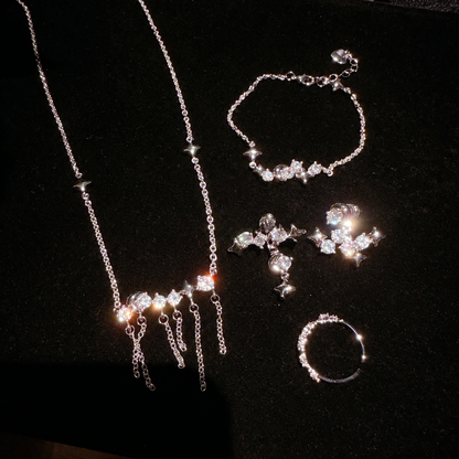 Women’s Celestial Cubic Zirconia Necklace, Earrings, Bracelet & Ring Set with Star and Tassel Details