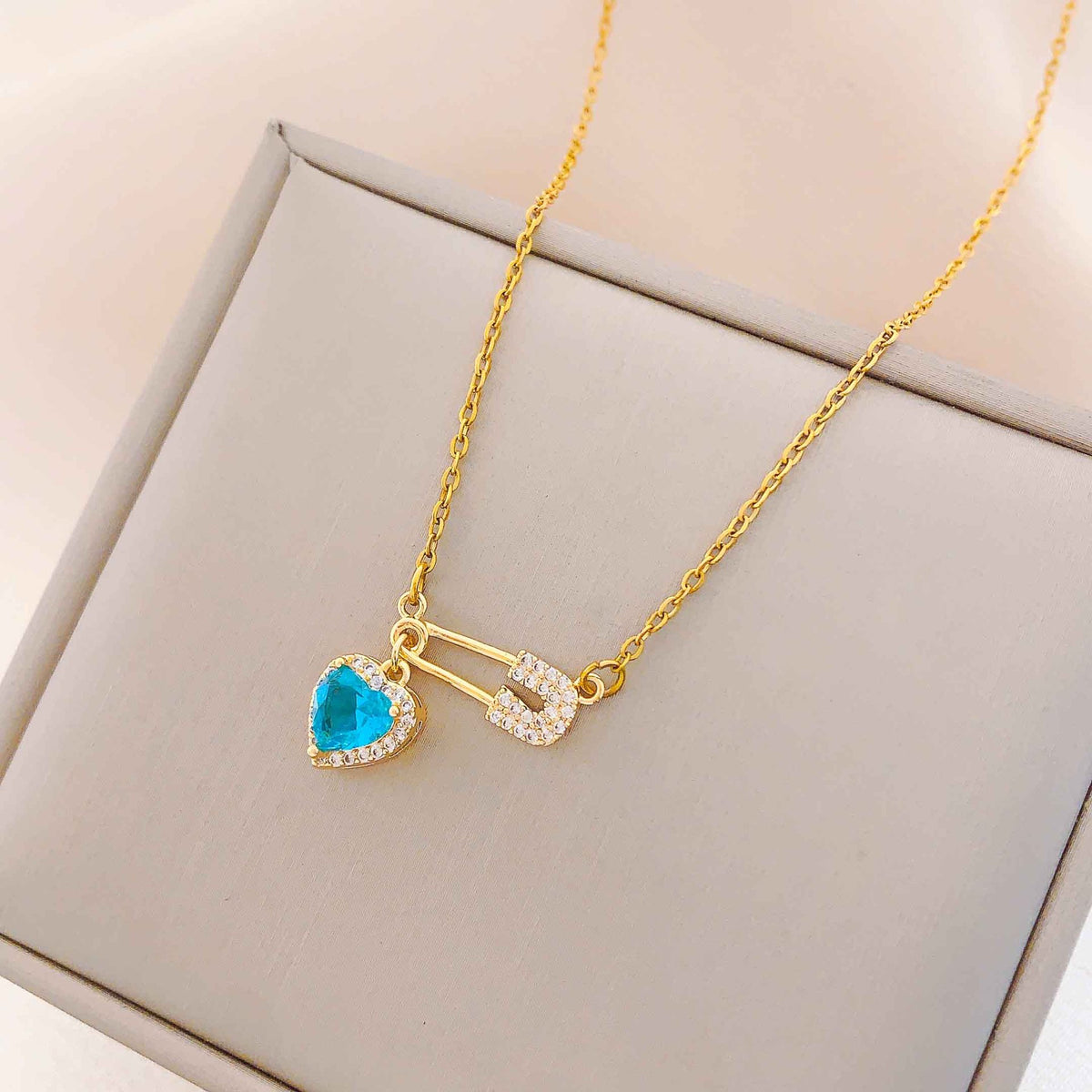 Women’s Dainty Safety Pin Necklace with Pink Heart and Sparkling Stone Detail